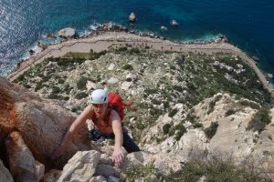 Simon Lake seconding pitch 4 of the epic climb Costa Blanca on the Penon D'Ifach.
