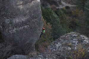 A climber on the amazing steep pocketed limestone of Cuenca.